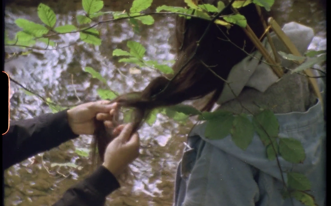 Filmstill from REROOTING by the Post (Film) Collective