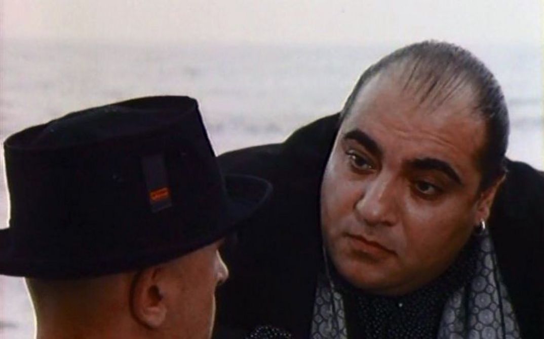 Film still from SECOND-CLASS CITIZEN: Two men in conversation.