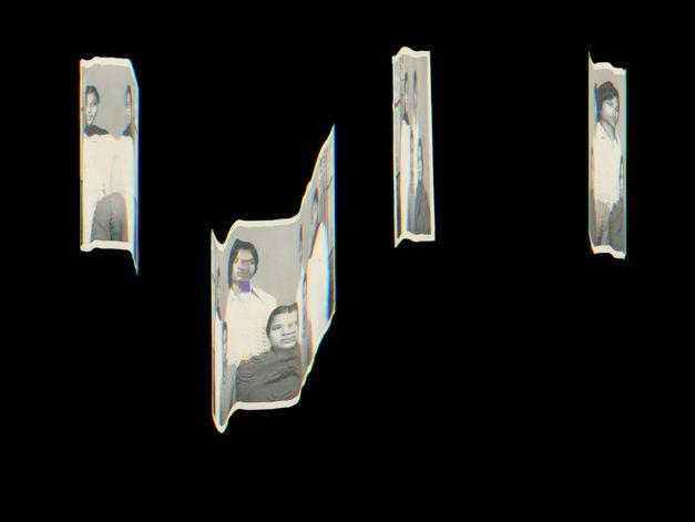 Film still from the film “A Circle as the Center of the Whole” by Utkarsh. Several narrow, fragmented black-and-white photo strips float in front of a black background. The strips show portraits of people, some distorted and incomplete, as if the images had been torn or bent.