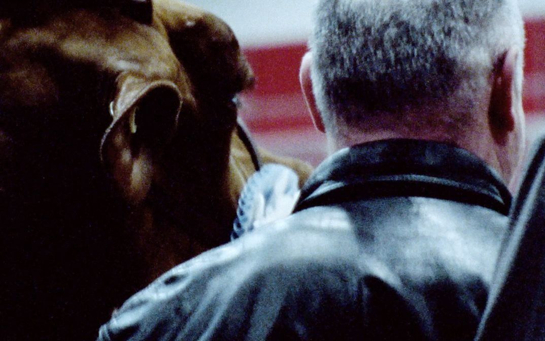 Still from the film "Surface Rites" by Parastoo Anoushahpour, Faraz Anoushahpour and Ryan Ferko. The back of a man