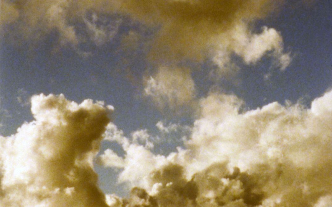 Film still from TEN SKIES: You can see the sky with a cloud formation.
